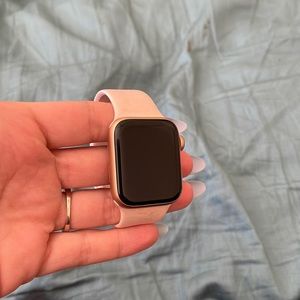 Series 4, 40mm Apple Watch. Scratch top right corner with charger.